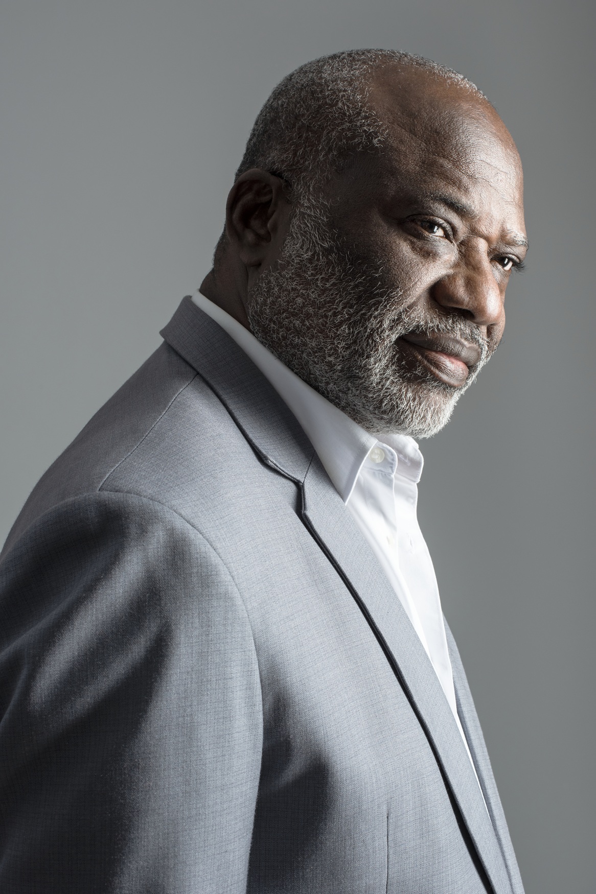 Studio portrait of an older man in a suit